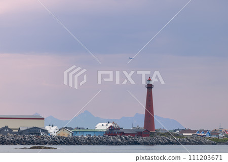 Andenes lighthouse stands as a red sentinel on Norway's rocky coastline Andenes lighthouse stands as a red sentinel on Norway's rocky coastline 111203671