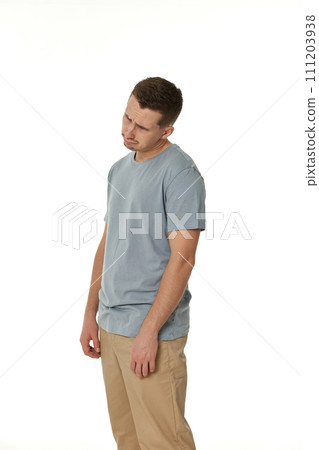 offended frustrated young man on white background. sadness offended frustrated young man on white background. sadness 111203938