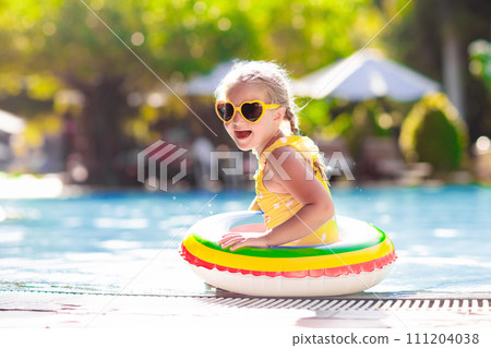 Child in swimming pool. Kids swim. Water play. Child in swimming pool. Kids swim. Water play. 111204038