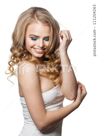 Stylish young woman with clean fresh skin and long curly hair looking at camera Stylish young woman with clean fresh skin and long curly hair looking at camera 111204263
