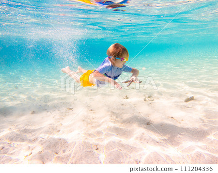 Child snorkeling. Kids underwater. Beach and sea. Child snorkeling. Kids underwater. Beach and sea. 111204336