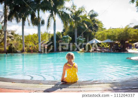 Child in swimming pool. Kids swim. Water play. 111204337