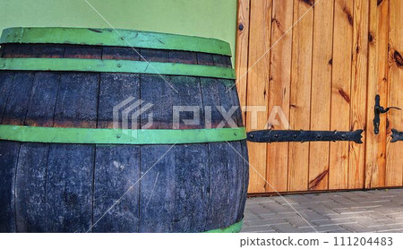 Old rustic wine barrel. Wine background in Europe. Czech Republic, South Moravia Old rustic wine barrel. Wine background in Europe. Czech Republic, South Moravia 111204483