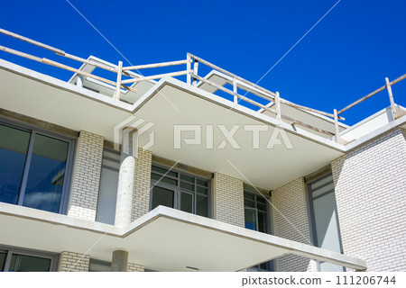 Top of new low-rise residential building under construction Top of new low-rise residential building under construction 111206744
