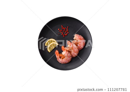 Delicious shrimp or langoustine tails boiled with salt and spices Delicious shrimp or langoustine tails boiled with salt and spices 111207781