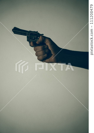 Gunman killer holding pistol artistic photo 111208479
