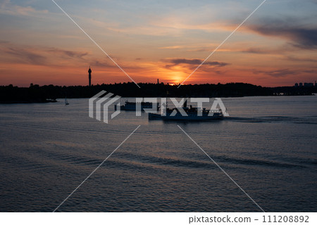 Scenic view of lake against sky at sunset, Nacka, Stockholm,Sweden. Scenic view of lake against sky at sunset, Nacka, Stockholm,Sweden. 111208892