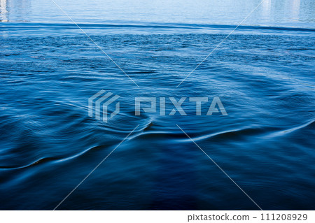 blue seawater texture. Blue seawater waves of sunlight. Top view. 111208929