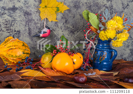 an autumn composition consisting of chrysanthemums, pumpkins, autumn leaves and chestnuts, kaki 111209118