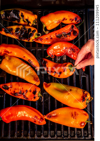 Red sweet kapia paprika on the grill 111209945