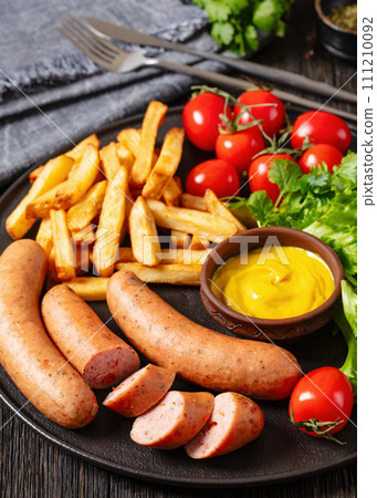 sausages with potato, lettuce, tomatoes, top view 111210092