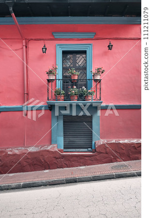 Street view of the facade of an old colonial building, Quito, Ecuador. 111211079
