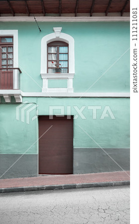 Street view of the facade of an old colonial building, Quito, Ecuador. 111211081