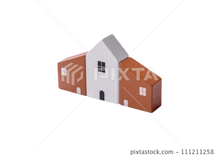 A small wooden house and keys as an idea for investing in your own home A small wooden house and keys as an idea for investing in your own home 111211258