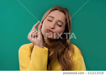 Young woman showing invisible small tiny abstract subject, object sizes Young woman showing invisible small tiny abstract subject, object sizes 111211519