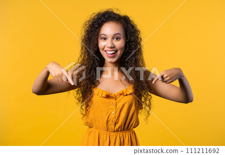 Pretty woman pointing down to advertising area. Yellow. click to subscribe below Pretty woman pointing down to advertising area. Yellow. click to subscribe below 111211692