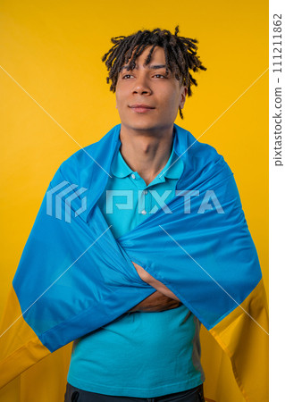 Superman with national Ukrainian flag. Ukraine, patriot, victory war celebration Superman with national Ukrainian flag. Ukraine, patriot, victory war celebration 111211862