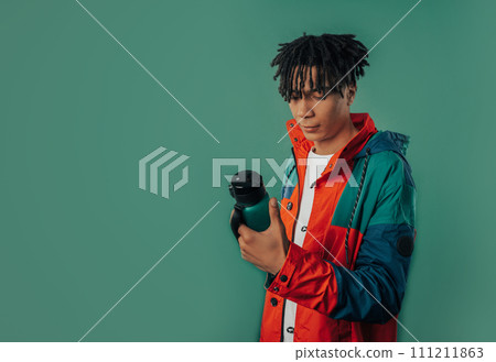 African man with battle. Water balance, jogging.Staying hydrated sports training African man with battle. Water balance, jogging.Staying hydrated sports training 111211863