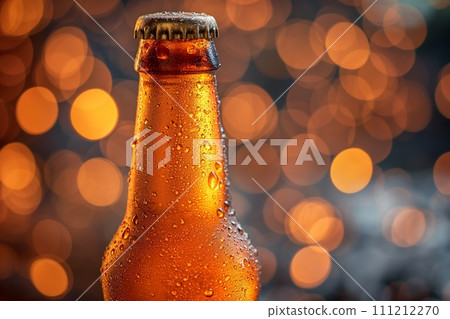 Close up view on a chilled beer bottle on bokeh background with space for text 111212270