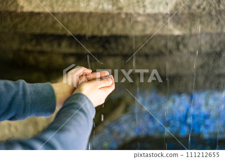 Kid hands under the water flow Kid hands under the water flow 111212655