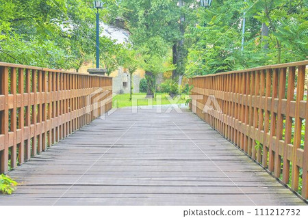 Old wooden bridge in town, natural vintage background 111212732