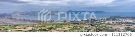 Panoramic View of Pollensa Bay in Mallorca with Coastal Towns and Mountain Backdrop Panoramic View of Pollensa Bay in Mallorca with Coastal Towns and Mountain Backdrop 111212766