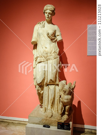 Statue of nemesis, Marble statues of gods and emperors of antiquity in the Museum of Antiquities of Antalya, Turkey. Statue of nemesis, Marble statues of gods and emperors of antiquity in the Museum of Antiquities of Antalya, Turkey. 111213028