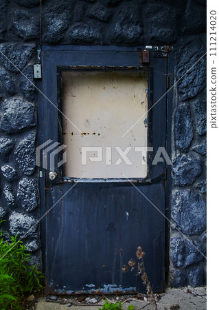 Weathered Blue Door in Black Stone Wall, Abandoned Hotel, Ohio 111214020