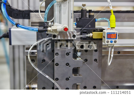 Industrial Pressure Gauge and Pneumatic Cylinder Close-Up 111214051