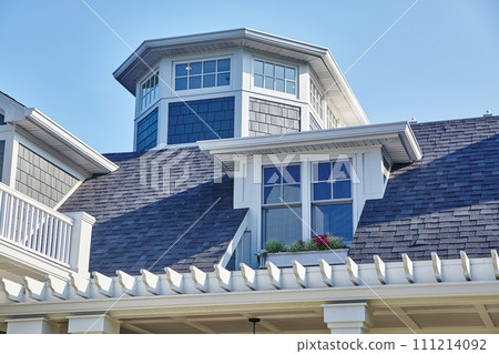 Luxury Suburban Home with Turret and Clear Blue Sky 111214092