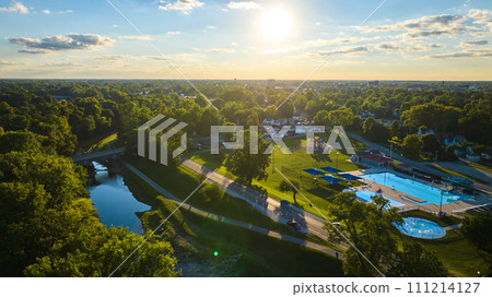 Tuhey Pool aerial in late afternoon with golden sunshine over neighborhood and White River, Muncie 111214127