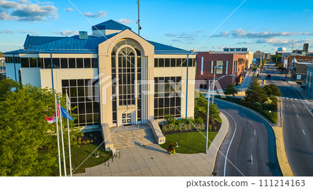 City of Muncie building aerial at sunset with gorgeous blue sky and street through downtown City of Muncie building aerial at sunset with gorgeous blue sky and street through downtown 111214163