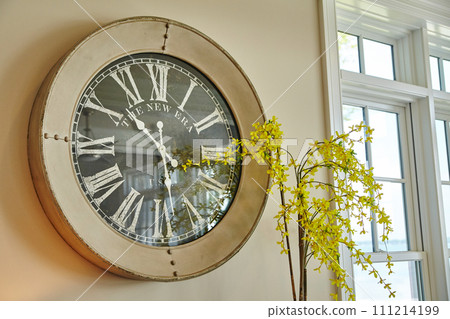 Vintage Clock and Forsythia Blooms in Serene Interior 111214199