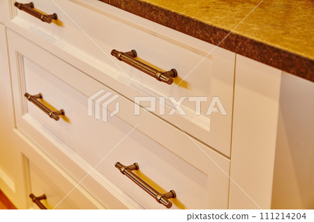Modern White Kitchen Drawers with Bronze Handles and Stone Countertop - Eye Level Modern White Kitchen Drawers with Bronze Handles and Stone Countertop - Eye Level 111214204