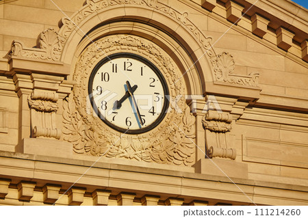 Golden Hour Clock on Historic Courthouse Facade, Low Angle View 111214260