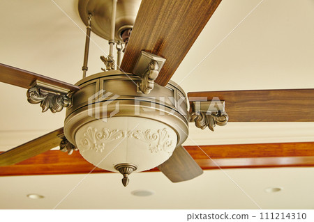 Elegant Traditional Ceiling Fan with Decorative Elements, Upward View Elegant Traditional Ceiling Fan with Decorative Elements, Upward View 111214310