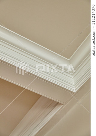 Elegant Crown Molding Detail in Modern Interior, Upward View Elegant Crown Molding Detail in Modern Interior, Upward View 111214376