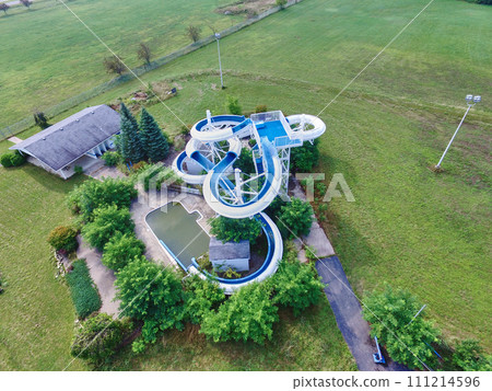 Aerial View of Private Water Slide and Pool in Suburban Setting 111214596
