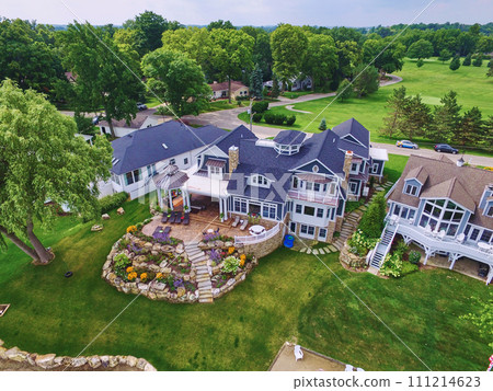Aerial View of Upscale Suburban Homes with Lush Gardens and Golf Course Aerial View of Upscale Suburban Homes with Lush Gardens and Golf Course 111214623