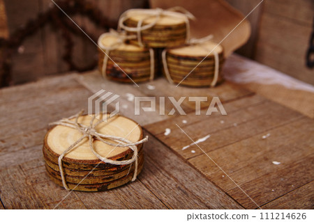 Handmade Wooden Coasters with Bark Edges on Rustic Table 111214626