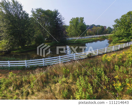 Aerial Serene Lakeside with White Fence and Lush Trees, Auburn 111214643