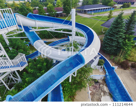 Aerial View of Empty Blue Water Slide Amidst Greenery in Indiana Aerial View of Empty Blue Water Slide Amidst Greenery in Indiana 111214644