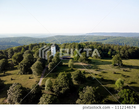 A white tower in a green park with a view of the horizon. Germany countryside 111214674