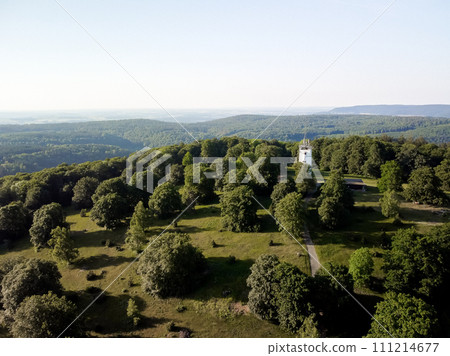 A white tower in a green park with a view of the horizon. Germany countryside 111214677