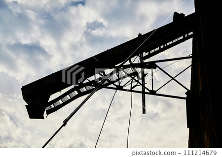 Industrial Crane Silhouette Against Cloudy Sky, Abandoned Ohio Elevator 111214679