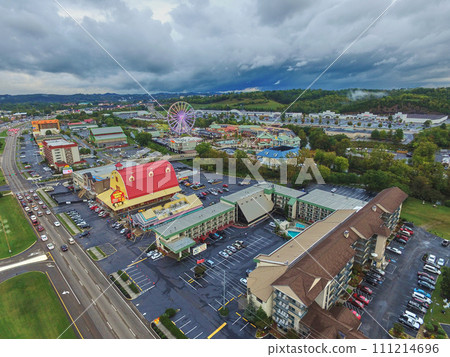 Aerial View of Ferris Wheel and Red Roof Hotel in Tourist City 111214696