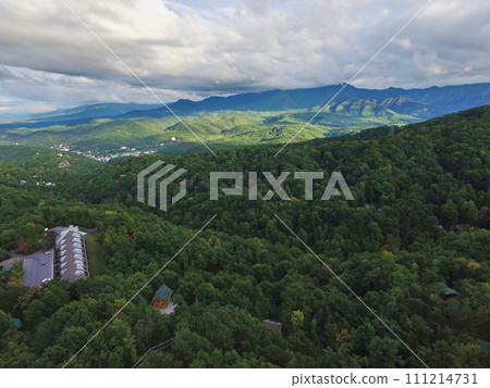 Aerial View of Lush Smoky Mountains and Rustic Village in Spring Aerial View of Lush Smoky Mountains and Rustic Village in Spring 111214731