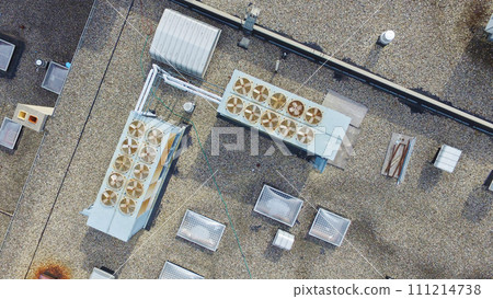 Aerial View of Commercial HVAC Units and Ventilation Equipment on Gravel Rooftop Aerial View of Commercial HVAC Units and Ventilation Equipment on Gravel Rooftop 111214738
