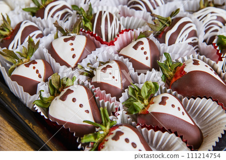 Gourmet Tuxedo Chocolate Strawberries in Paper Cups Close-Up 111214754