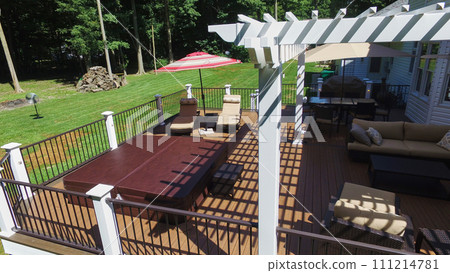 Aerial Suburban Backyard Oasis with Pergola and Hot Tub 111214781